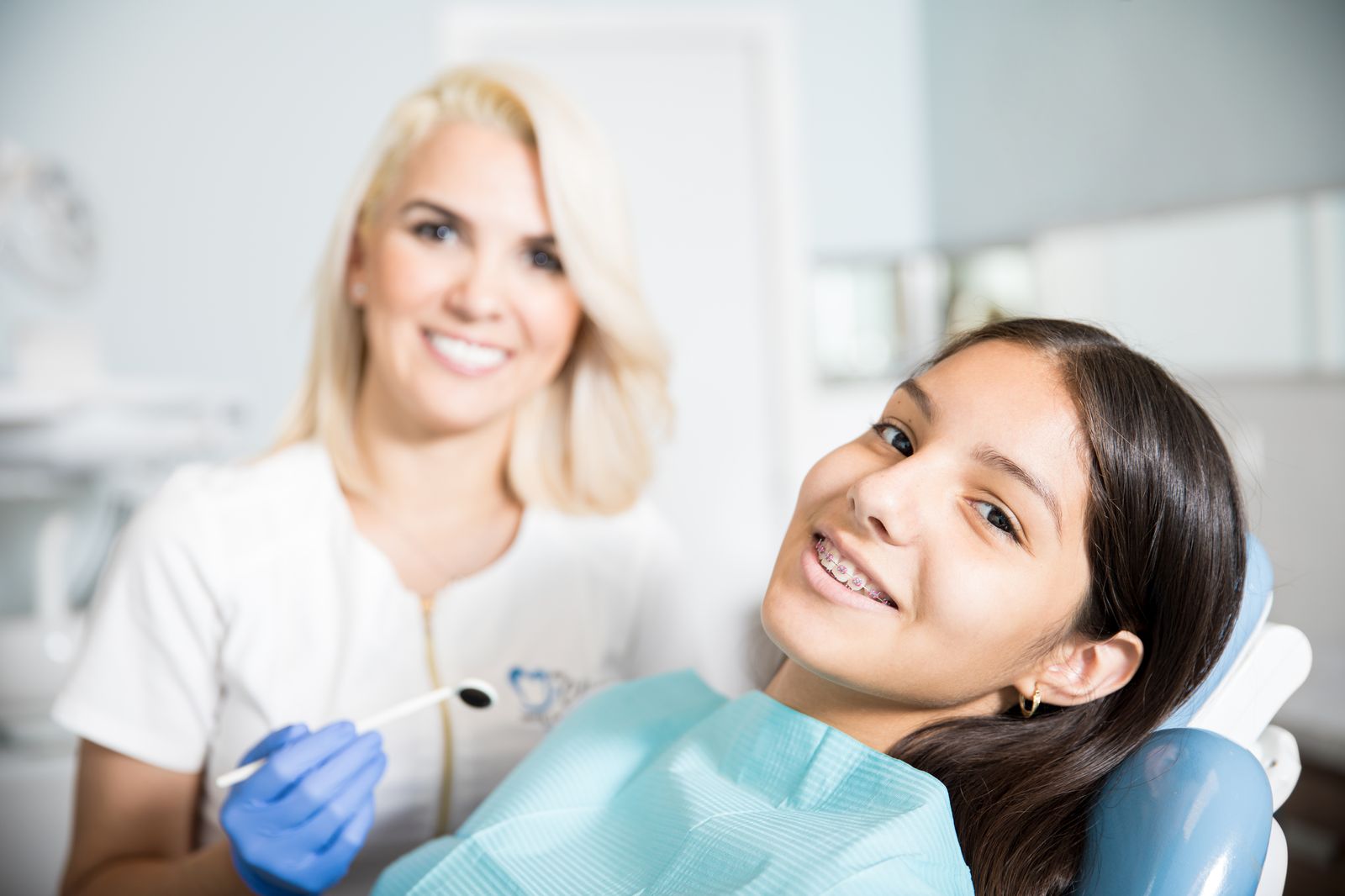 Dentist with a smiling patient in a California dental clinic