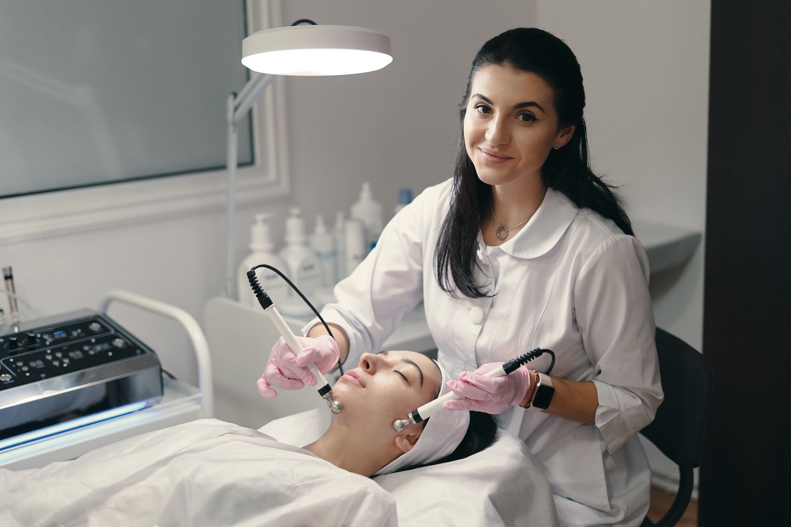 Aesthetician performing a facial treatment at a California med spa